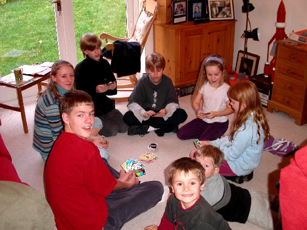 20th Century family: the kids play cards
